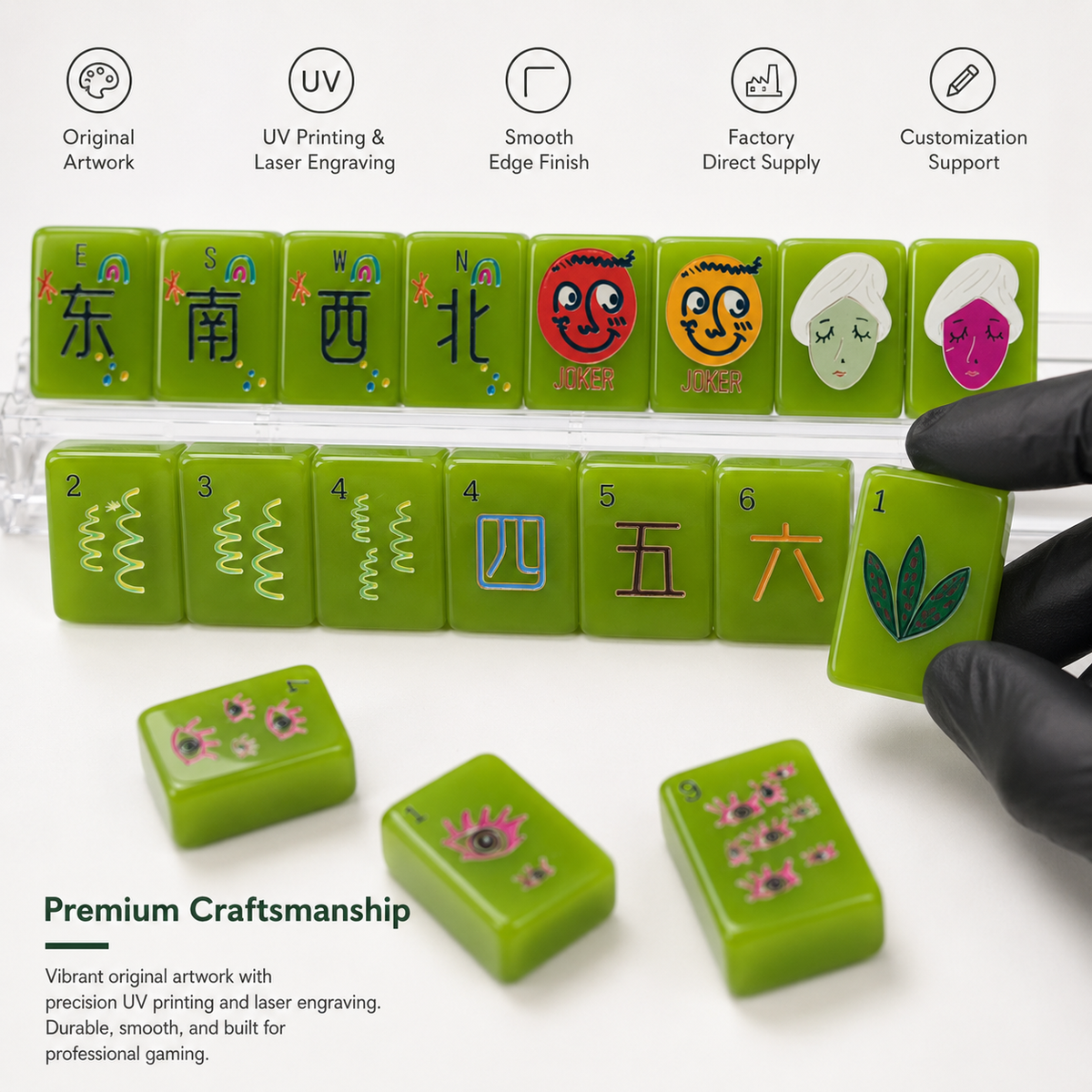 Green mahjong tiles with colorful Chinese characters and floral designs, shown on a white background with a black-gloved hand holding one tile. Text highlights original artwork, UV printing, laser engraving, smooth edges, and customization support.