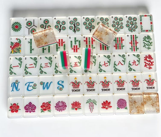 Rose Garden American Mahjong Tile Set with floral Dots, bamboo Bams, vine-accented Craks, blue Winds, flower tiles and floral Jokers.