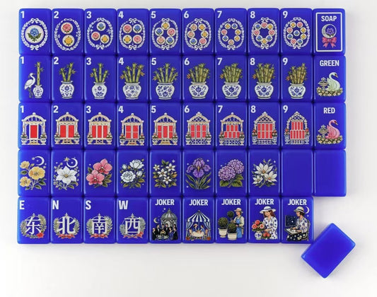The Southern Peacock light blue mahjong storage bag with American Mahjong tiles, blue tile pouch and dice inside.