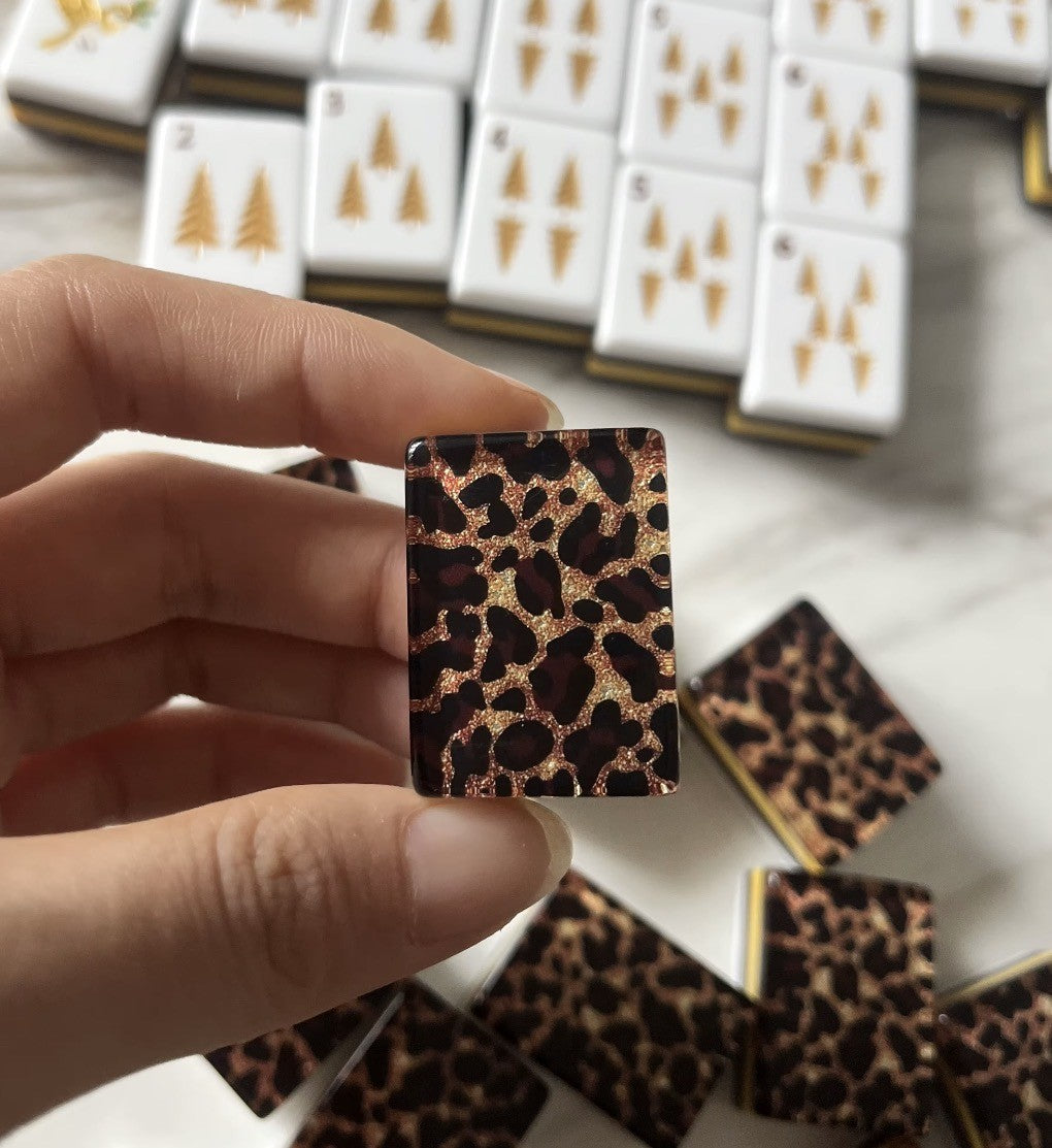 Leopard print backs on American mahjong tiles with gold edge detail