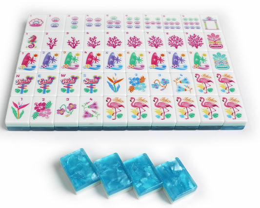 Mahjong set with a grid of white tiles decorated with colorful tropical and floral illustrations, plus four translucent blue rectangular pieces placed in front on a white background.