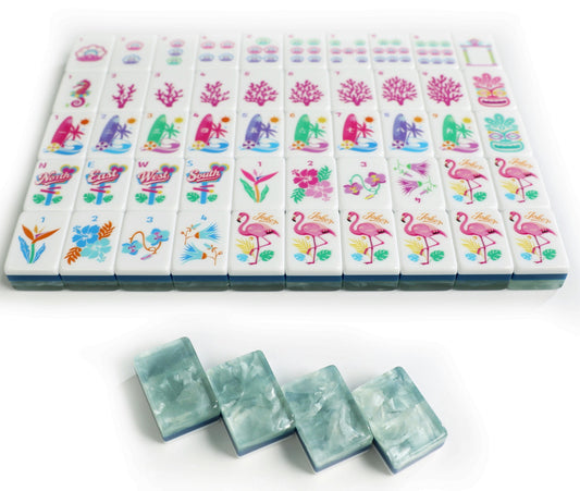 Colorful American Mahjong tiles with flamingos, florals, coral-inspired Bams, decorative Winds and translucent blue-green tile backs. 