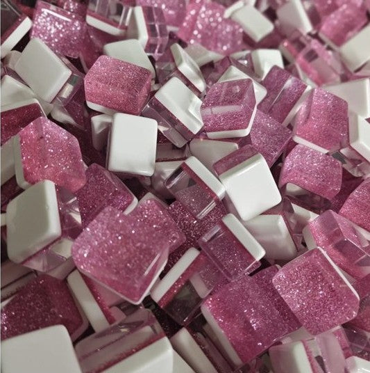 Pink glitter-backed American mahjong tiles with white faces